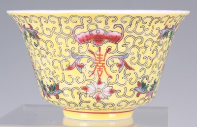 Lot 100 - A CHINESE YELLOW GLAZE RICE BOWL with flower...