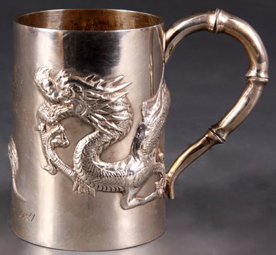Lot 119 - A Chinese SILVER MUG with relief moulded...