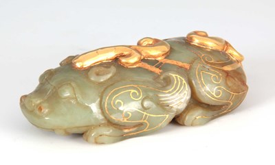 Lot 158 - A CHINESE JADE AND GILT SCULPTURE modeled as a...