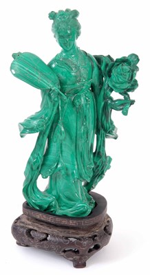 Lot 164 - A CHINESE MALACHITE CARVED FIGURE ON HARDWOOD...