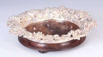 Lot 226 - AN ELABORATE CAST SILVER PLATED BOTTLE COASTER...