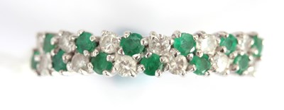 Lot 253 - AN 18K WHITE GOLD EMERALD AND DIAMOND RING app....