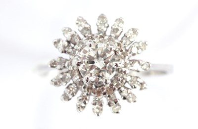 Lot 272 - A WHITE GOLD SOLITAIRE CLUSTER RING the...