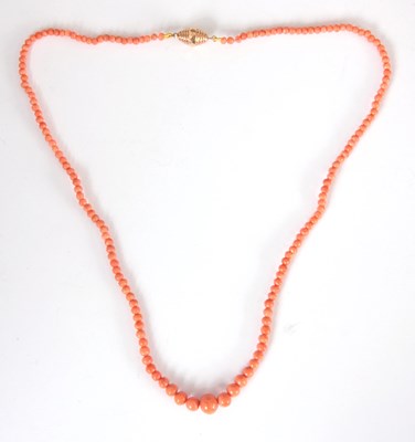 Lot 284 - A CORAL NECKLACE of graduated coral beads with...