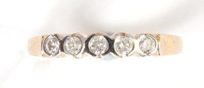 Lot 285 - A FIVE STONE 9K YELLOW GOLD AND DIAMOND-SET...