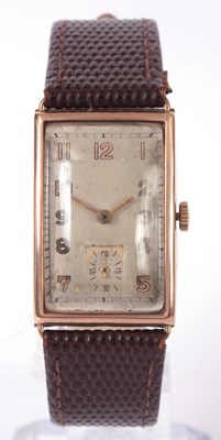 Lot 336 - A GENTLEMAN'S 1930's 9K GOLD RECTANGULAR WRIST...