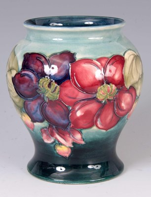 Lot 38 - A WALTER MOORCROFT BULBOUS FOOTED VASE...