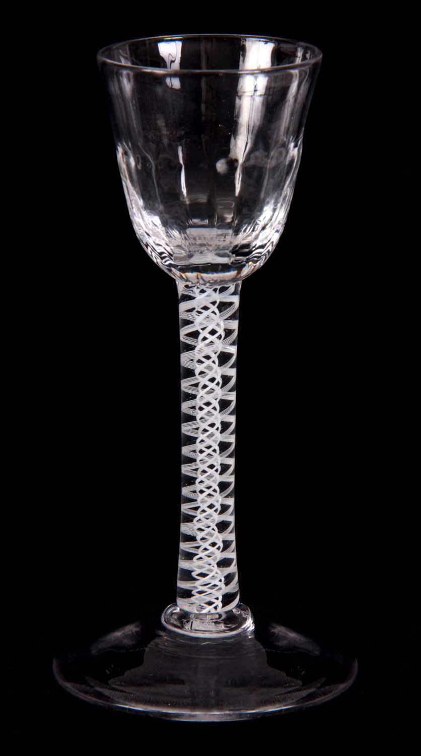 Lot 4 - AN 18TH CENTURY CORDIAL GLASS with ogee fluted...