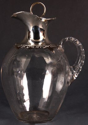 Lot 208 - A Victorian clear Glass CLARET JUG with ornate...