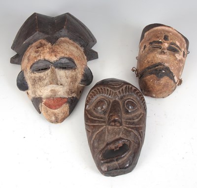 Lot 429 - THREE AFRICAN TRIBAL CARVED WOODEN MASKS two...