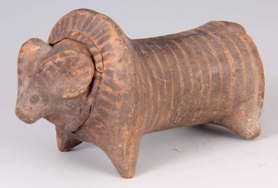 Lot 491 - AN ANTIQUE EGYPTIAN CLAY RELIC OF A BULL with...