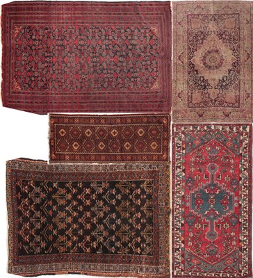 Lot 560 - FOUR ANTIQUE TURKISH RUGS