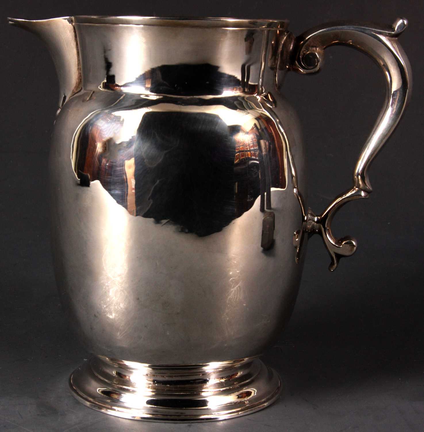 Lot 214 - A George II Silver ALE JUG of footed bellied...