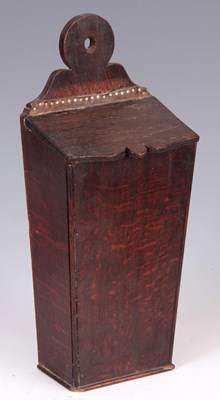 Lot 620 - A GEORGE III TAPERING OAK CANDLE BOX with ring-...