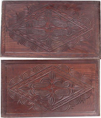 Lot 622 - A PAIR OF LOZENGE SHAPED CARVED PANELS with...