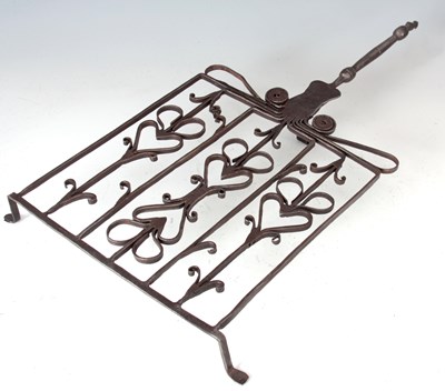 Lot 625 - AN 18TH CENTURY IRONWORK OVERSIZED TRIVET with...