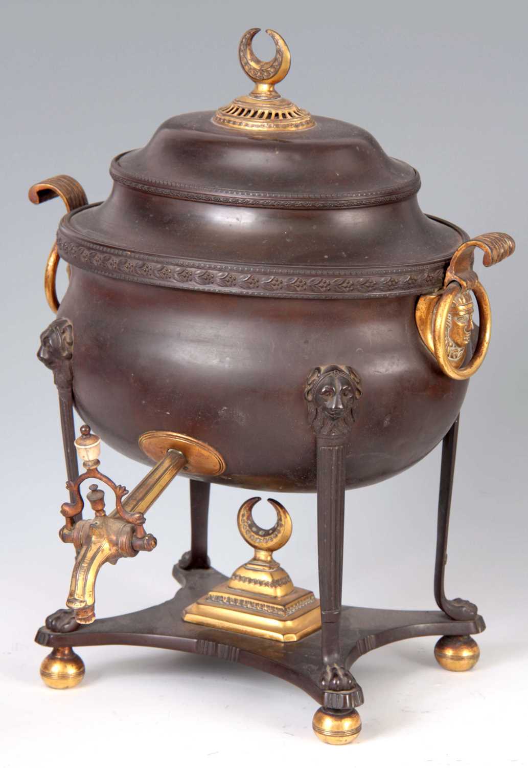 Lot 629 - A REGENCY BRONZE AND ORMOLU MOUNTED TEA URN...