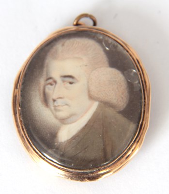 Lot 658 - A GEORGE III MINIATURE PORTRAIT ON IVORY in a...