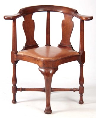 Lot 940 - A GEORGE II WALNUT CORNER CHAIR with rounded...