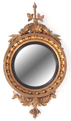 Lot 976 - A REGENCY CONVEX GILT GESSO HANGING MIRROR...