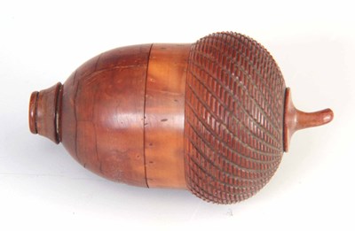 Lot 594 - A 19TH CENTURY TURNED COQUILLA NUT NUTMEG...