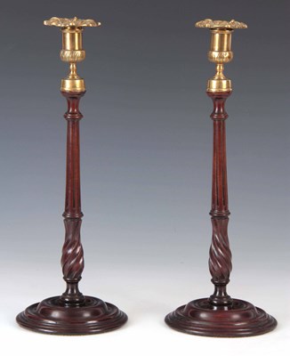 Lot 607 - A PAIR OF GEORGE III MAHOGANY CANDLESTICKS...