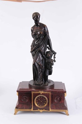 Lot 574 - A LARGE FIGURAL BRONZE AND ROUGE MARBLE MANTEL...