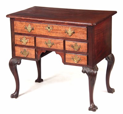 Lot 695 - A MID 18TH CENTURY FIGURED MAHOGANY IRISH...