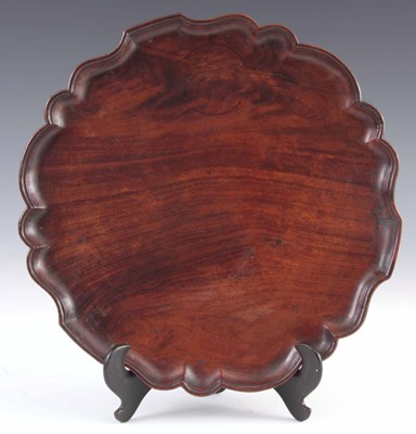 Lot 617 - A GEORGE III FIGURED MAHOGANY DRINKS TRAY with...