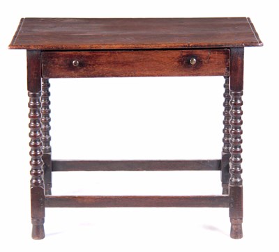 Lot 683 - A 17TH CENTURY OAK SIDE TABLE with overhanging...