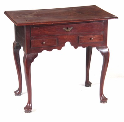 Lot 713 - A GEORGE II MAHOGANY LOWBOY having a...