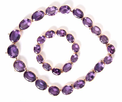 Lot 180 - A VICTORIAN AMETHYST AND GOLD BACKED NECKLACE...