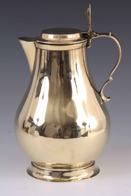 Lot 266 - AN 18TH CENTURY SEAMED BRASS WATER JUG AND...