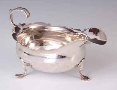 Lot 145 - A GEORGE III SILVER SAUCE BOAT having a...