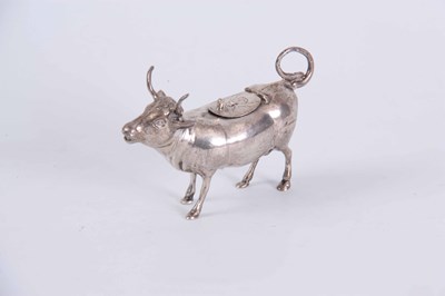 Lot 132 - A DUTCH SILVER COW CREAMER with a bee embossed...