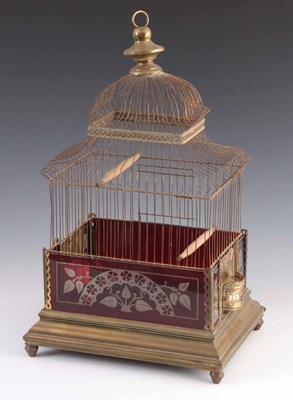 Lot 384 - A VICTORIAN BRASS AND CRANBERRY GLASS BIRDCAGE...