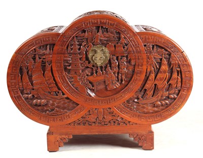 Lot 126 - A CARVED CHINESE HARDWOOD SHAPED BLANKET BOX...