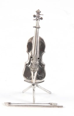 Lot 229 - A MINIATURE SILVER VIOLIN ON STAND with silver...