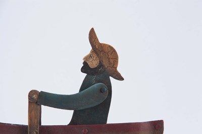 Lot 511 - A FOLK ART PAINTED STEEL AUTOMATON ROWING BOAT,...