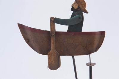 Lot 511 - A FOLK ART PAINTED STEEL AUTOMATON ROWING BOAT,...