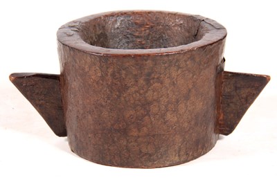 Lot 609 - AN EARLY CHIP CARVED WALNUT MORTAR with angled...