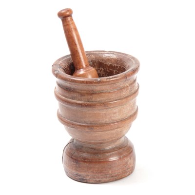 Lot 634 - A 17TH CENTURY BEECH MORTAR AND LATER PESTLE...