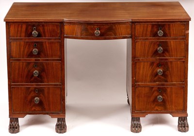 Lot 909 - A LATE GEORGIAN MAHOGANY KNEEHOLE DESK WITH...